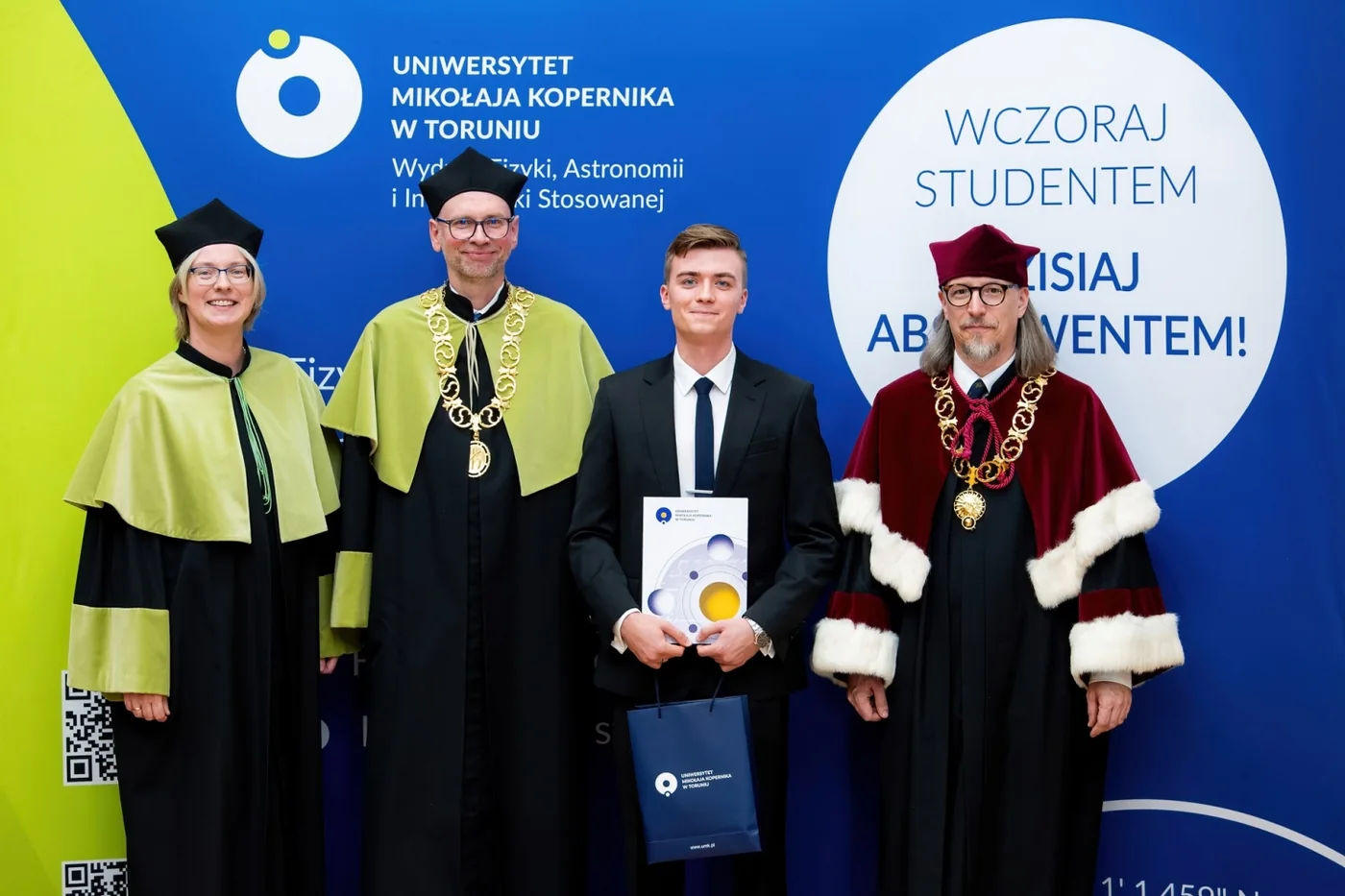 From left: A. Bartkiewicz, W. Drozdowski, Marcin Makowski holding his award certificate, and A. Kola