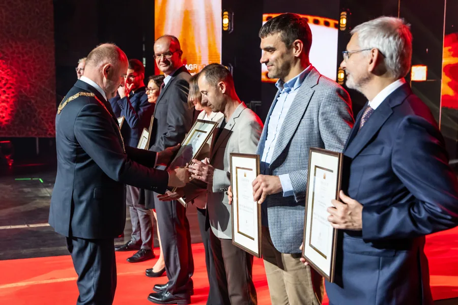 Researchers holding framed certificates during the Marshal’s Awards ceremony