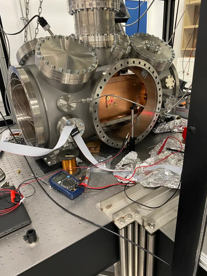 Open vacuum chamber with the inner copper shield and diagnostic instruments